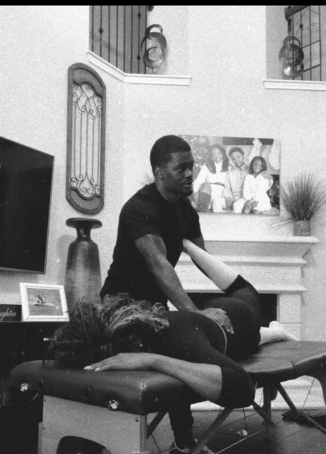 Assisted stretch session in black and white